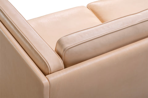 Close up of JG Sofa arm and cushion in natural leather with piping detail, Danish craftsmanship by Fredericia
