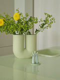 Muuto Kink Vase in modern living room decor with greenery