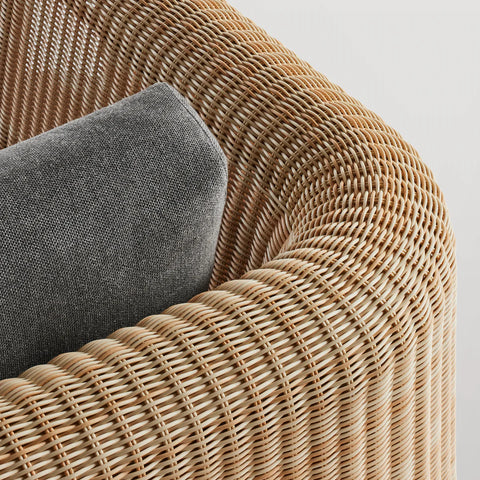 Loophole Outdoor Lounge Chair by Blu Dot, curved all-weather rattan back detail with Toohey Charcoal cushion