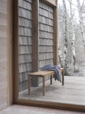 Scandinavian bench with wool blanket by muuto 