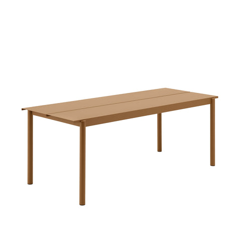 linear steel outdoor table by muuto in burnt orange