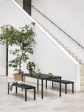 minimalist steel outdoor dining table and steel benches by muuto 