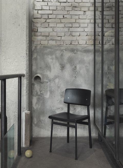 loft chair on apartment balcony designed by muuto