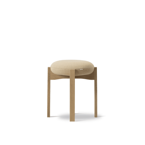 Pioneer Stool by Fredericia, oak base with rounded upholstered seat, front view