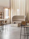 Audo Copenhagen Tearoom Sofa, High Back, beige Tearoom Sofa, High Back with US Power Outlet, in a minimalist room with a terrazzo coffee table and sheer curtains