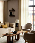 scandinavian living room furniture featuring a androgyne coffee table designed by Danielle Siggerud and harbour lounge chairs designed by norm architects for audo copenhagen