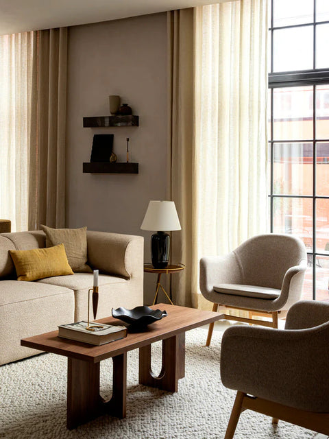 scandinavian living room furniture featuring a androgyne coffee table designed by Danielle Siggerud and harbour lounge chairs designed by norm architects for audo copenhagen