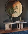 scandinavian inspired foyer with a marble bench