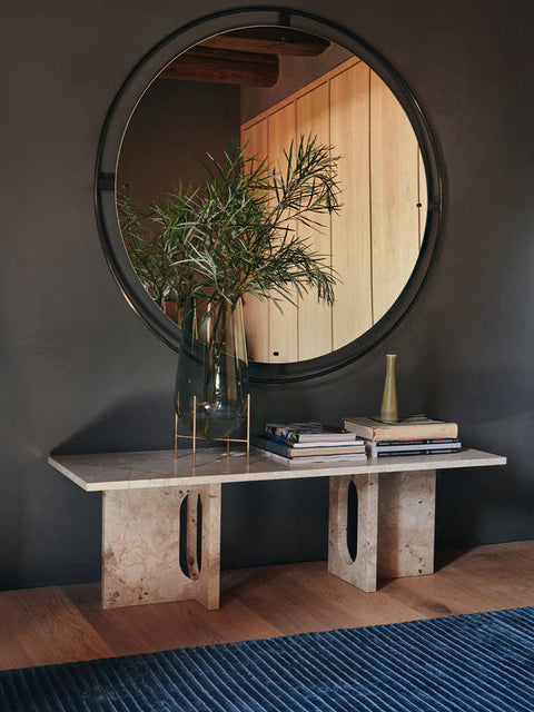 scandinavian inspired foyer with a marble bench