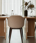 dark stained oak Androgyne Dining Table and designed by Danielle Siggerud and harbour dining chair designed by norm architects for Audo Copenhagen