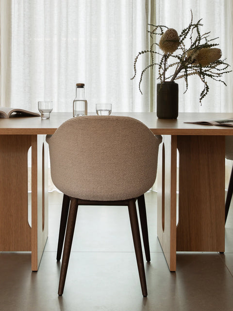 dark stained oak Androgyne Dining Table and designed by Danielle Siggerud and harbour dining chair designed by norm architects for Audo Copenhagen