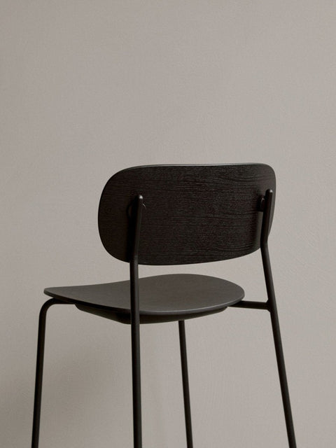 Audo Copenhagen Co Bar Chair, Non-Upholstered, rear close-up of the Co Bar Chair in dark stained oak veneer, focusing on the textured backrest and slim black metal frame