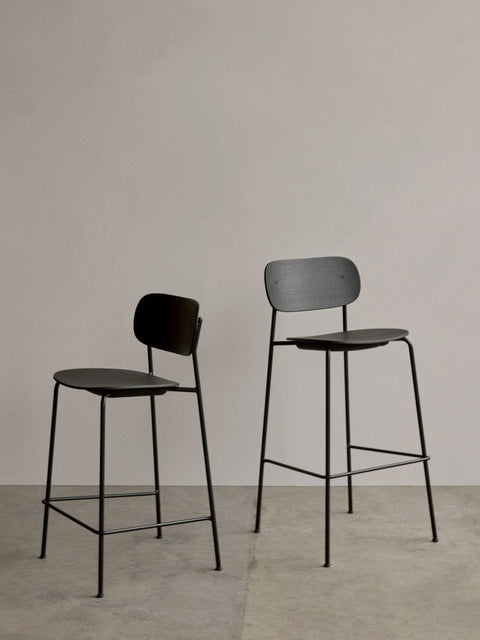 Audo Copenhagen Co Bar Chair, Non-Upholstered, the Co Counter Chair and Co Bar Chair, both in black oak veneer with black steel frames