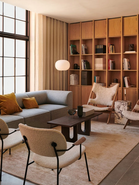 Audo Copenhagen Co Lounge Chair, Fully Upholstered, living room with an Eave Sofa, two Co Lounge Chairs, a Knitting Chair, and an Androgyne Lounge Table on a Houkime Rug