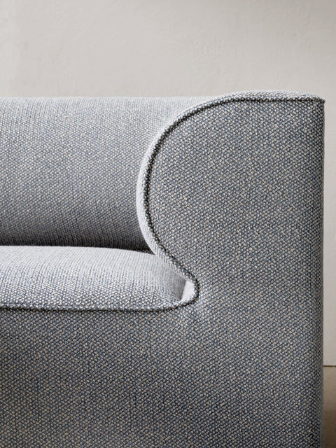 Close-up of Eave Modular Sofa armrest in textured grey upholstery