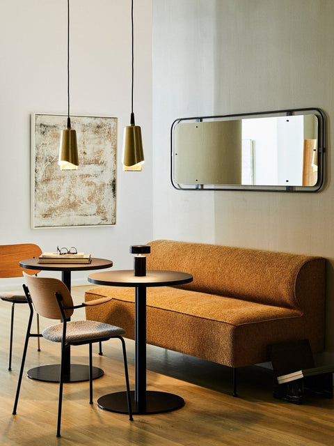 Audo Copenhagen Co Dining Chair, With Arms, Fully Upholstered, dining nook with a yellow Eave Dining Sofa, tables, and a Co Dining Chair. A Column Table Lamp and Nimbus Pendants