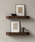 bronze table lamp portable on a wall shelf designed by norm architects for audo copenhagen