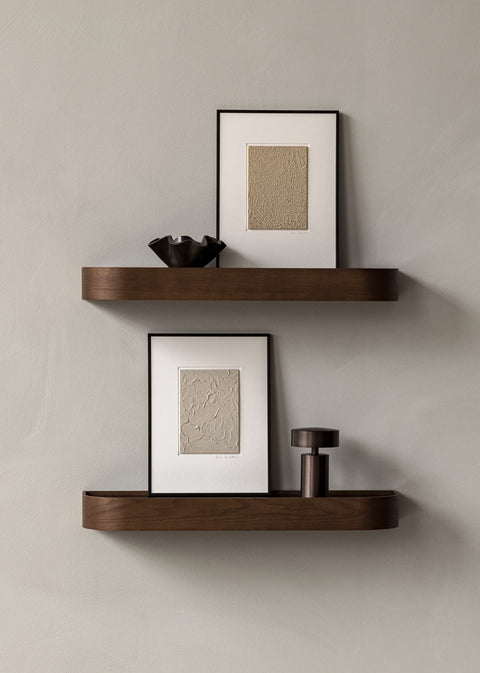 bronze table lamp portable on a wall shelf designed by norm architects for audo copenhagen