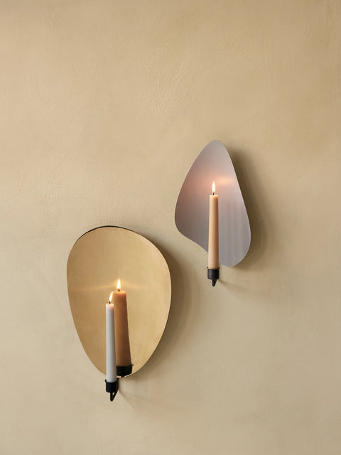 wall hung candle holder with organic shape in bronzed brass finish by audo copenhagen