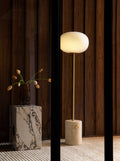 jwda travertine wall lamp and marble plinth end table by audo copenhagen