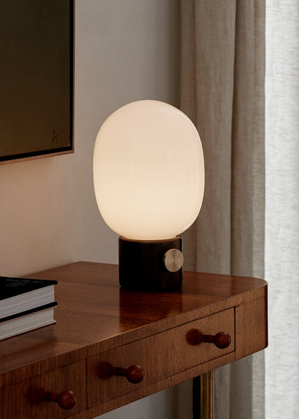 scandinavian portable table lamp on vintage console table