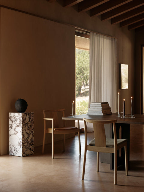 scandinavian dining room featuring a marble plinth pedestal and natural oak Merkur Dining Chair designed by Skogstad & Wærnes for audo copenhagen