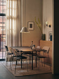 Audo Copenhagen Co Dining Chairs around a Snaregade table on a Houkime Rug. A Levitate Pendant lights the scene, with an Aer Vase nearby