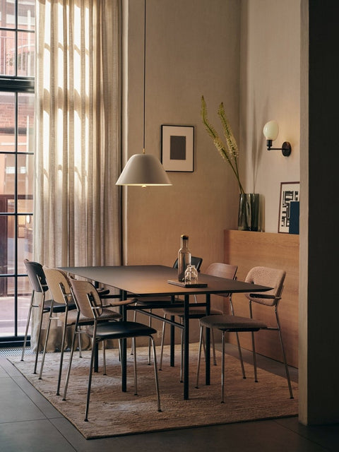 Audo Copenhagen Co Dining Chairs around a Snaregade table on a Houkime Rug. A Levitate Pendant lights the scene, with an Aer Vase nearby