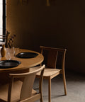 minimalist and scandinavian dining room featuring natural oak Merkur Dining Chair designed by Skogstad & Wærnes for audo copenhagen