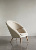 mid century modern oda lounge chair in hallingdal fabric and natural oak finish by audo copenhagen