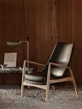 Audo Copenhagen Seal Lounge Chair, High Back with the Wing Table Lamp