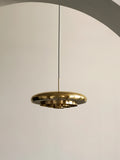 resonant ceiling light fixture in brushed brass designed by Alf Svensson & Yngvar Sandström for audo copenhagen