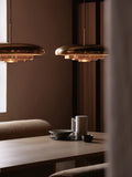 resonant ceiling light fixture in brushed brass designed by Alf Svensson & Yngvar Sandström for audo copenhagen