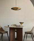 resonant ceiling light fixture in brushed brass designed by Alf Svensson & Yngvar Sandström for audo copenhagen