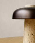 scandinavian reverse table lamp with travertine and brushed brass designed by Aleksandar Lazic for audo copenhagen