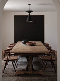 rustic dining table and rusting chairs in a scandinavian home