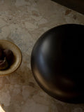 wooden scandinavian vase on a marble slab coffee table