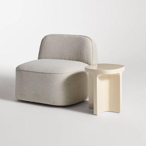 Small Talk Tall Side Table by Blu Dot in Ivory glass fiber reinforced concrete, styled with lounge chair, 3/4 view