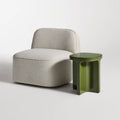 Small Talk Tall Side Table by Blu Dot in Olive glass fiber reinforced concrete, styled with lounge chair, 3/4 view