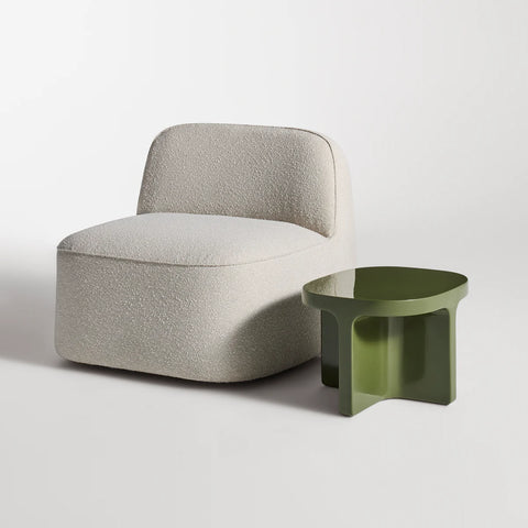 Small Talk Side Table by Blu Dot in Olive glass fiber reinforced concrete, styled with lounge chair, 3/4 view