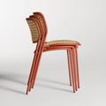 Made You Look Outdoor Chair by Blu Dot in Tomato, three chairs stacked, side view