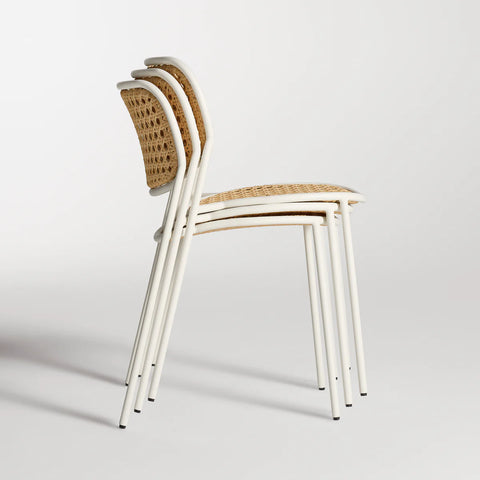 Made You Look Outdoor Chair by Blu Dot in White, three chairs stacked, side view