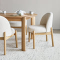 Gus Modern Malloy dining chair cream boucle fabric with natural oak wood legs - Mid-Century Modern furniture Canada
