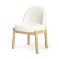 Malloy dining chair by Gus Modern in cream boucle upholstery at oak dining table - Canadian interior design furniture