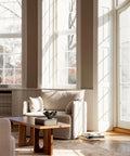 scandinavian living room with big windows and high ceilings featuring furniture by audo copenhagen