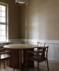 natural oak merkur dining chair with arms and dakar leather seat designed by Skogstad & Wærnes for audo copenhagen