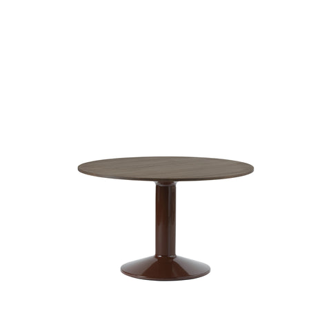 midst table by muuto in dark oak tabletop and dark red base 