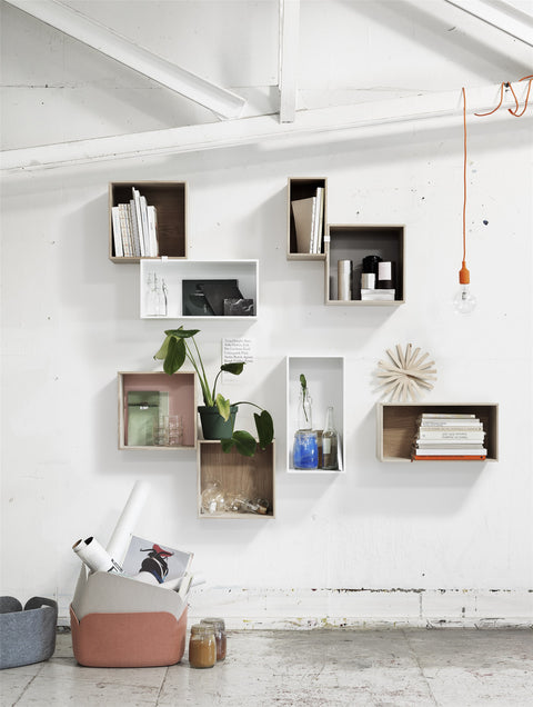 Muuto Mini Stacked Storage System in a cozy lounge space, perfect for decluttering and enhancing modern interiors