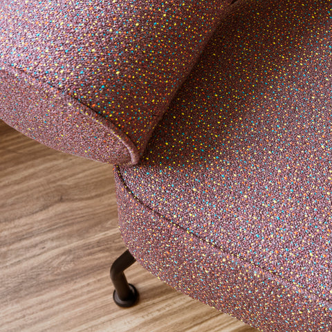 Close-up detail of Gus Modern Mirador lounge chair burgundy multi-color speckled fabric texture showing webbed suspension seat construction