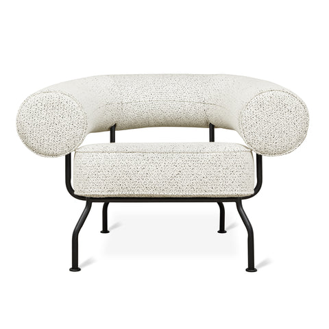 Gus Modern Mirador lounge chair in off-white speckled fabric with tubular backrest and black steel frame